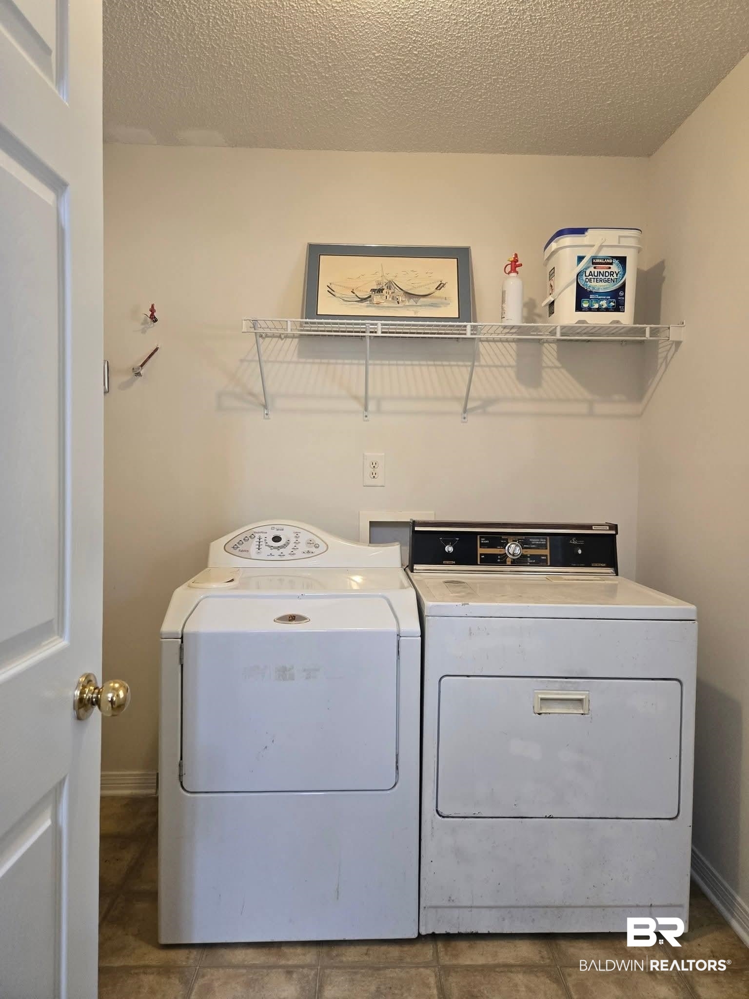 2554 Riverside Drive Mobile, AL 36605 - Photo 10 of 43 Laundry room with a textured ceiling and independent washer and dryer