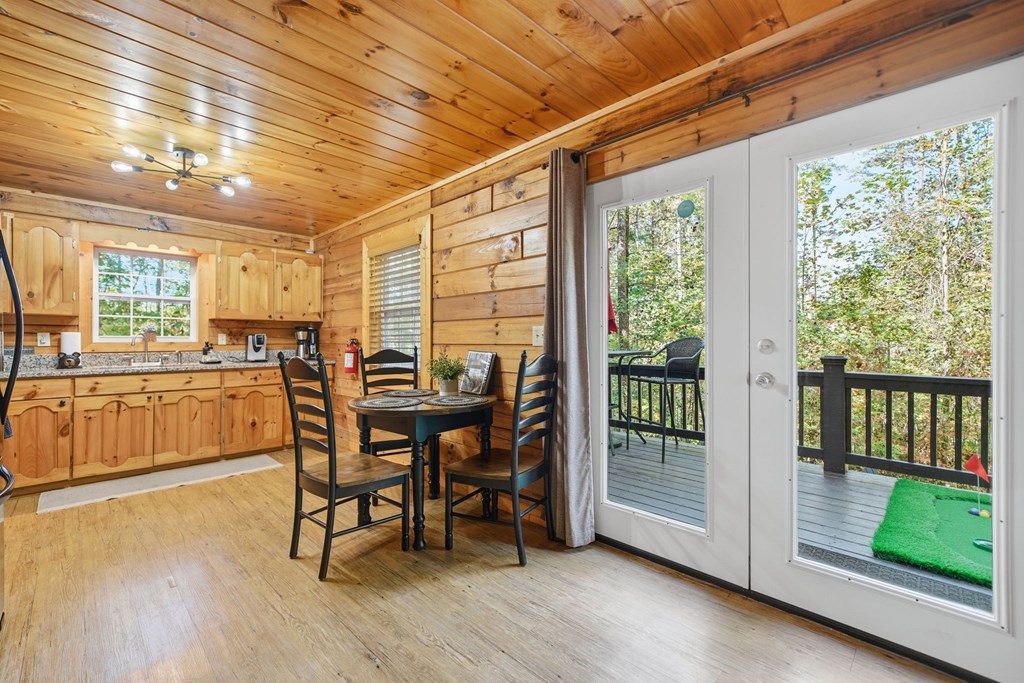 25 Foster Lane Morganton, GA 30560 - Photo 12 of 28 a view of a dining room with furniture and wooden floor