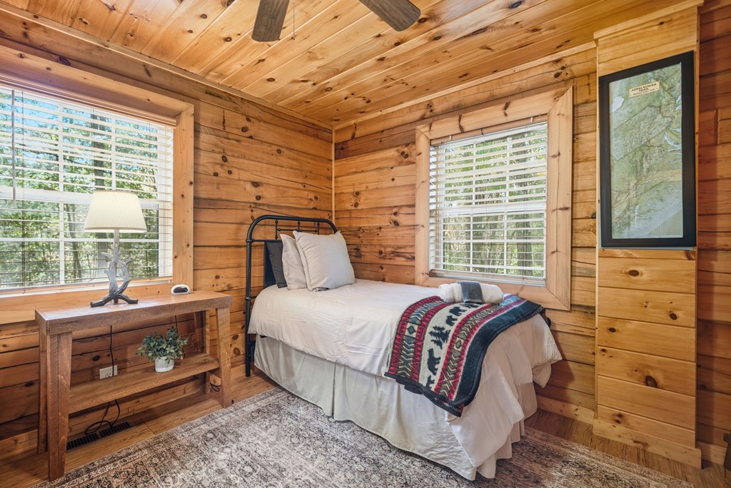 25 Foster Lane Morganton, GA 30560 - Photo 19 of 28 a bed sitting in a bedroom next to a window