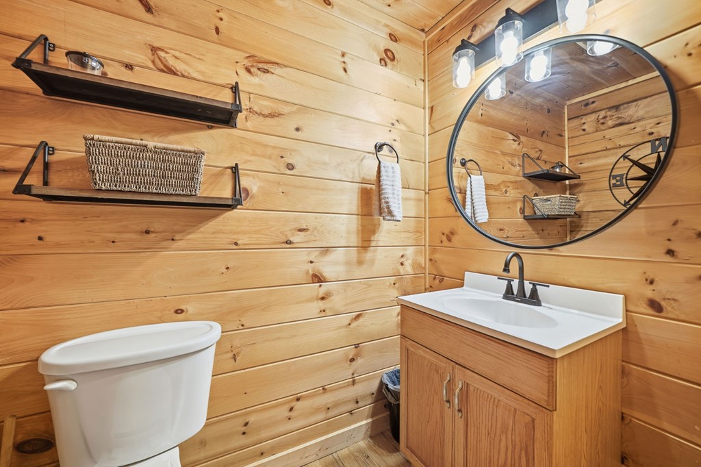 25 Foster Lane Morganton, GA 30560 - Photo 23 of 28 a bathroom with a sink and a mirror