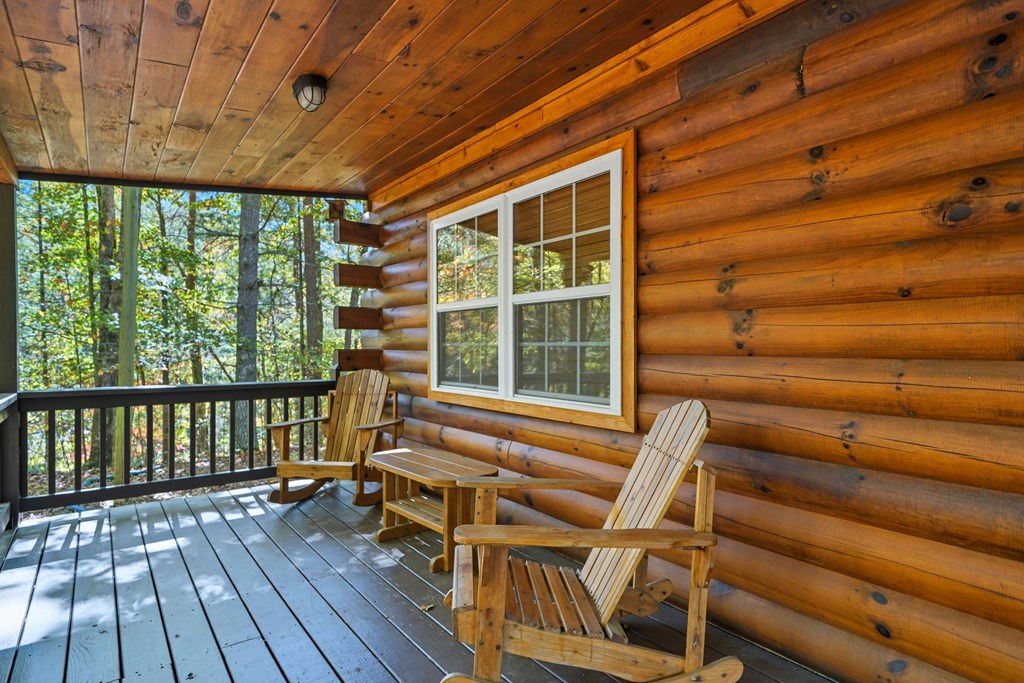 25 Foster Lane Morganton, GA 30560 - Photo 6 of 28 a view of a patio with table and chairs with wooden floor and fence