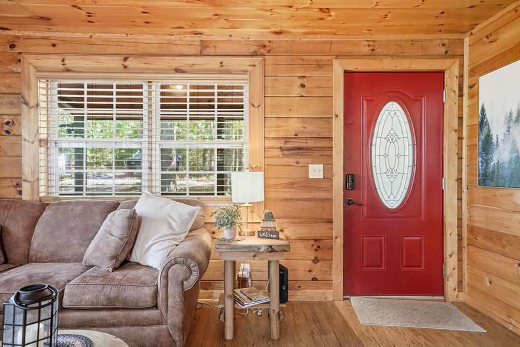 25 Foster Lane Morganton, GA 30560 - Photo 8 of 28 a living room with furniture a table and a large window