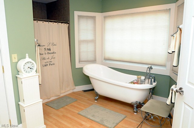 Master ensuite bath with claw foot soaking tub. Tiled shower.