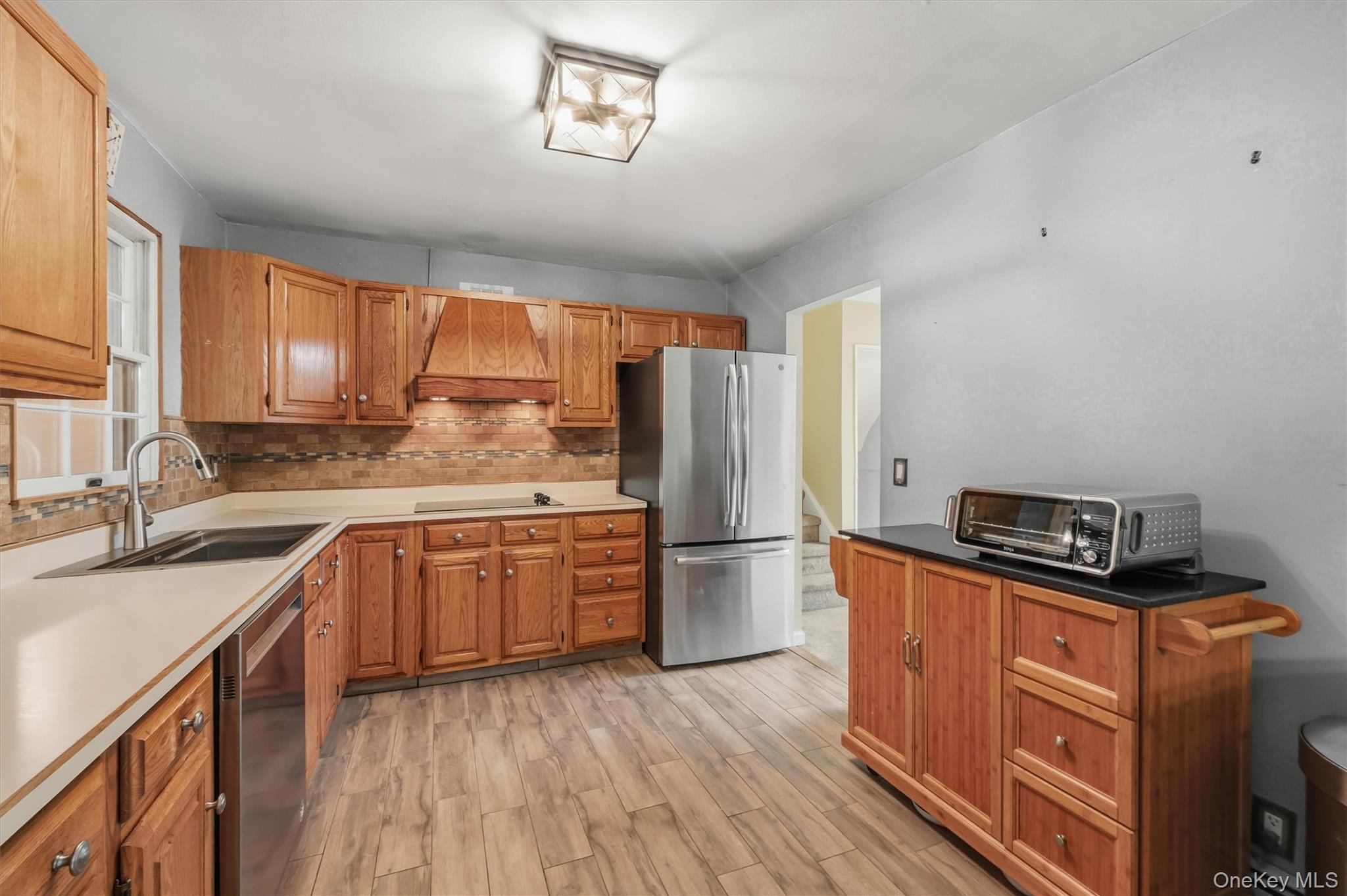 17 Ridge Road Cortlandt Manor, NY 10567 - Photo 11 of 38 Nice sized kitchen with good cabinet space and tiled floor & backsplash