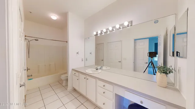 a bathroom with a bathtub and shower