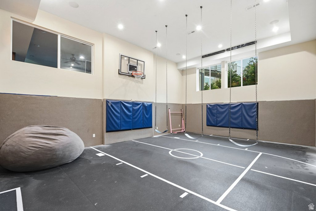 672 Perry Hollow Drive Mapleton, UT 84664 - Photo 81 of 106 Indoor athletic court with marked flooring, a mounted basketball hoop, and padded wall protection