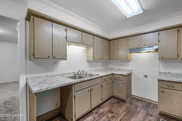 a kitchen with a sink stove and refrigerator