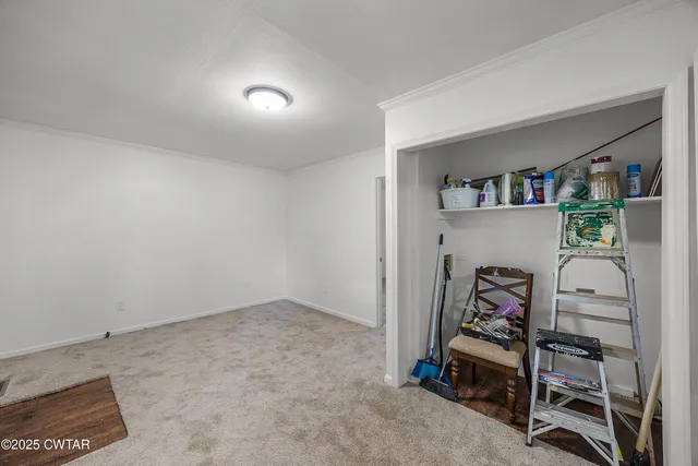a view of a livingroom with shelves