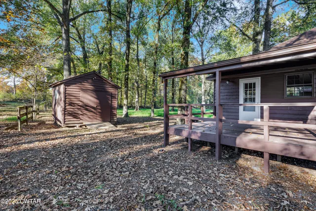 a backyard of a house with barbeque oven