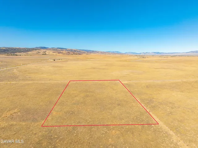 a view of an ocean and a mountain