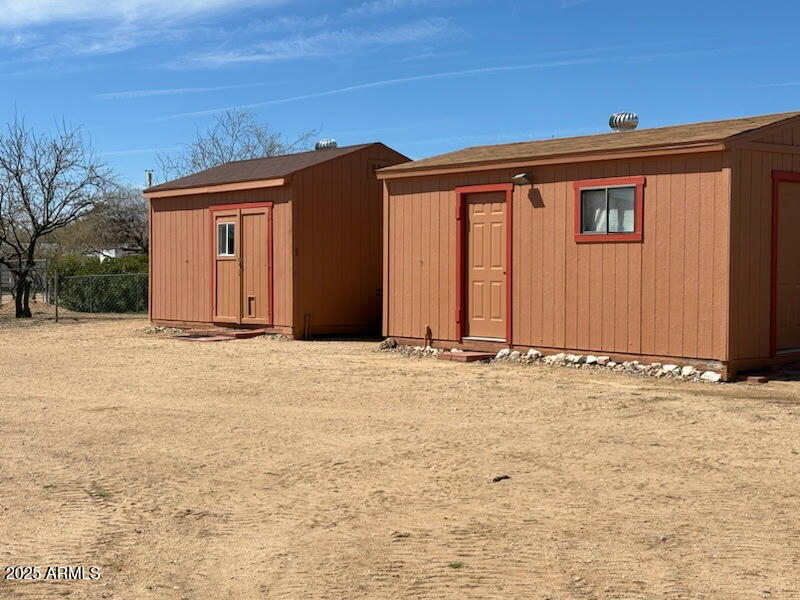 23300 West Mule Deer Lane, Unit 2 Congress, AZ 85332 - Photo 3 of 17 a view of entryway with wooden walls