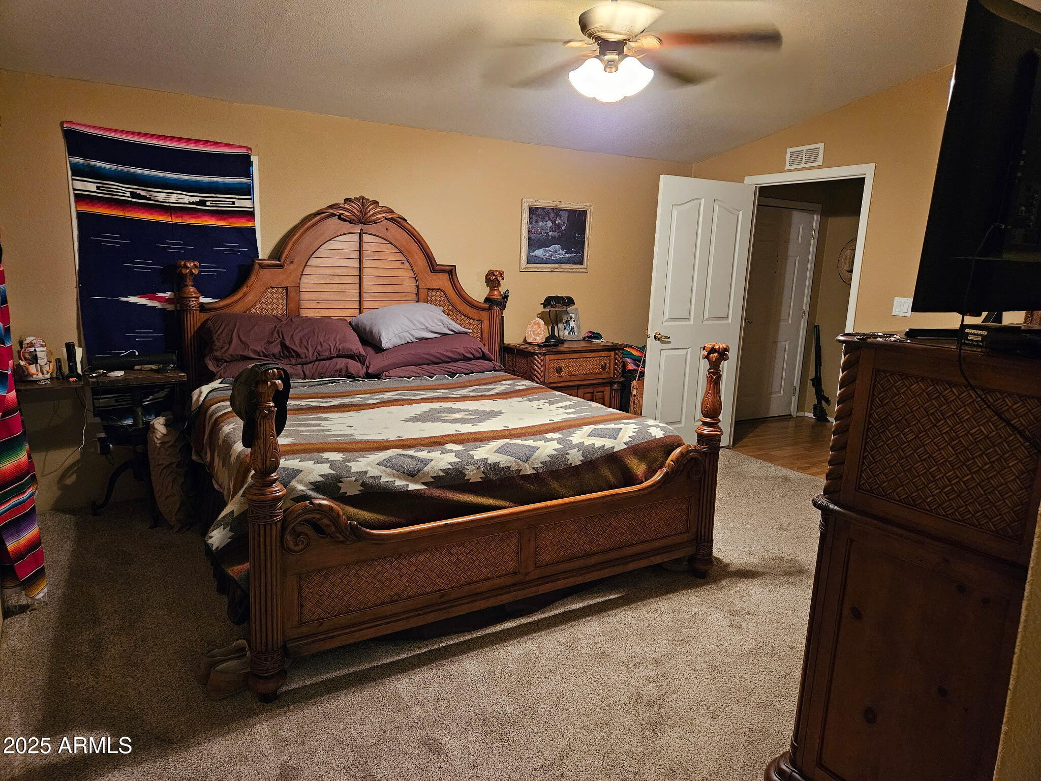 23300 West Mule Deer Lane, Unit 2 Congress, AZ 85332 - Photo 5 of 17 a bed room with a bed and a television