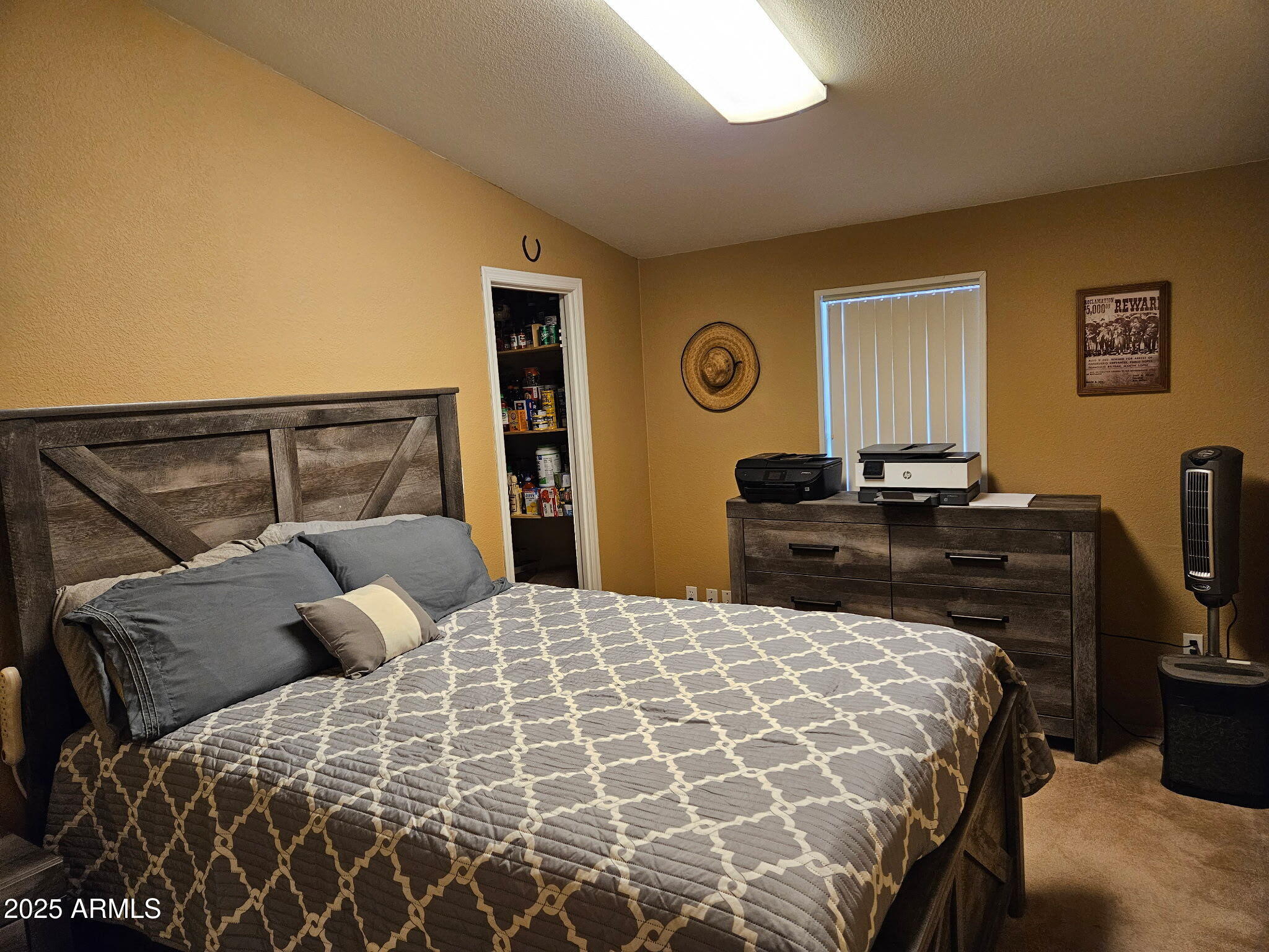 23300 West Mule Deer Lane, Unit 2 Congress, AZ 85332 - Photo 6 of 17 a bedroom with a bed and a lamp on dresser