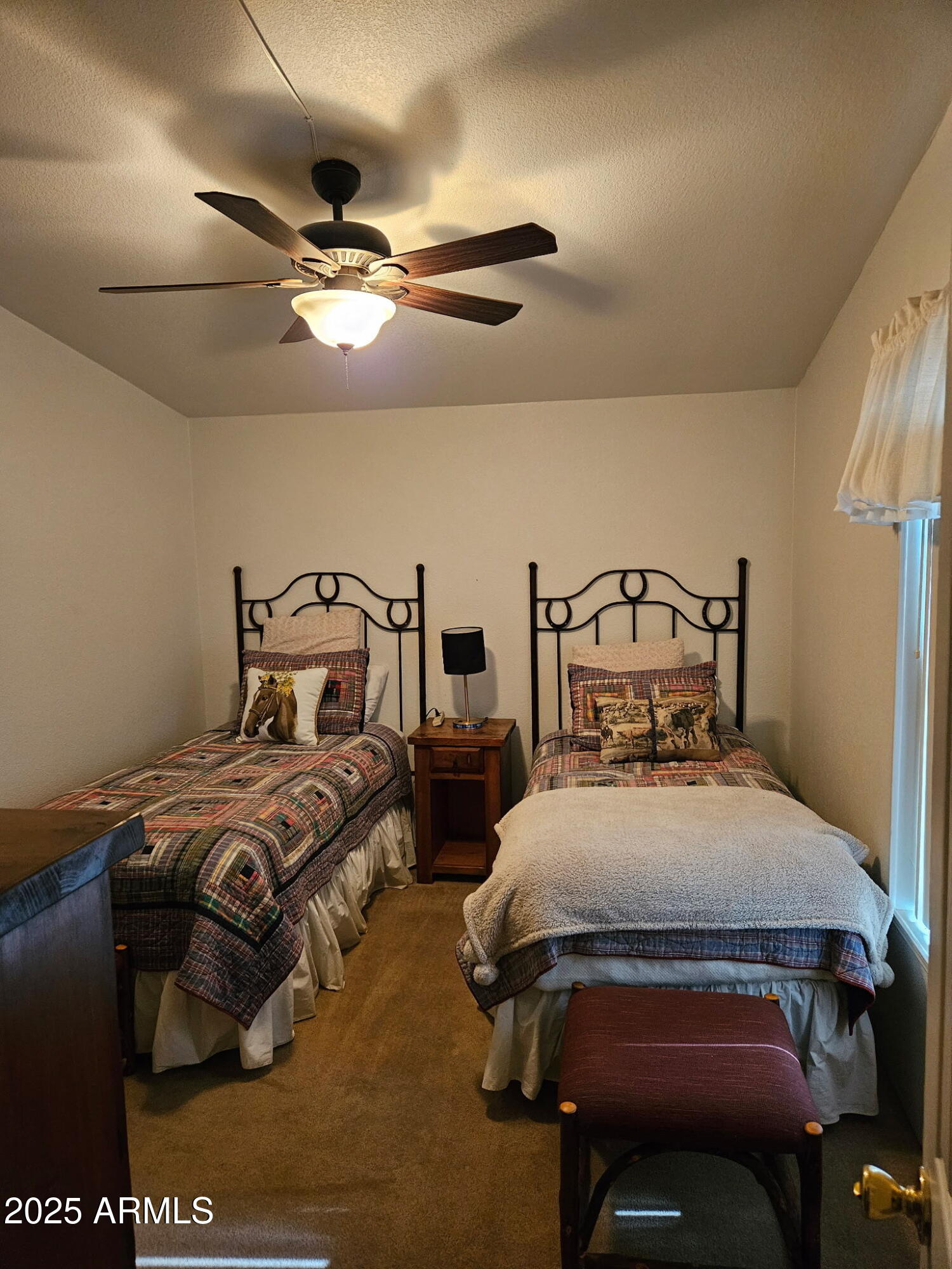 23300 West Mule Deer Lane, Unit 2 Congress, AZ 85332 - Photo 7 of 17 a bedroom with two beds and painting on the wall