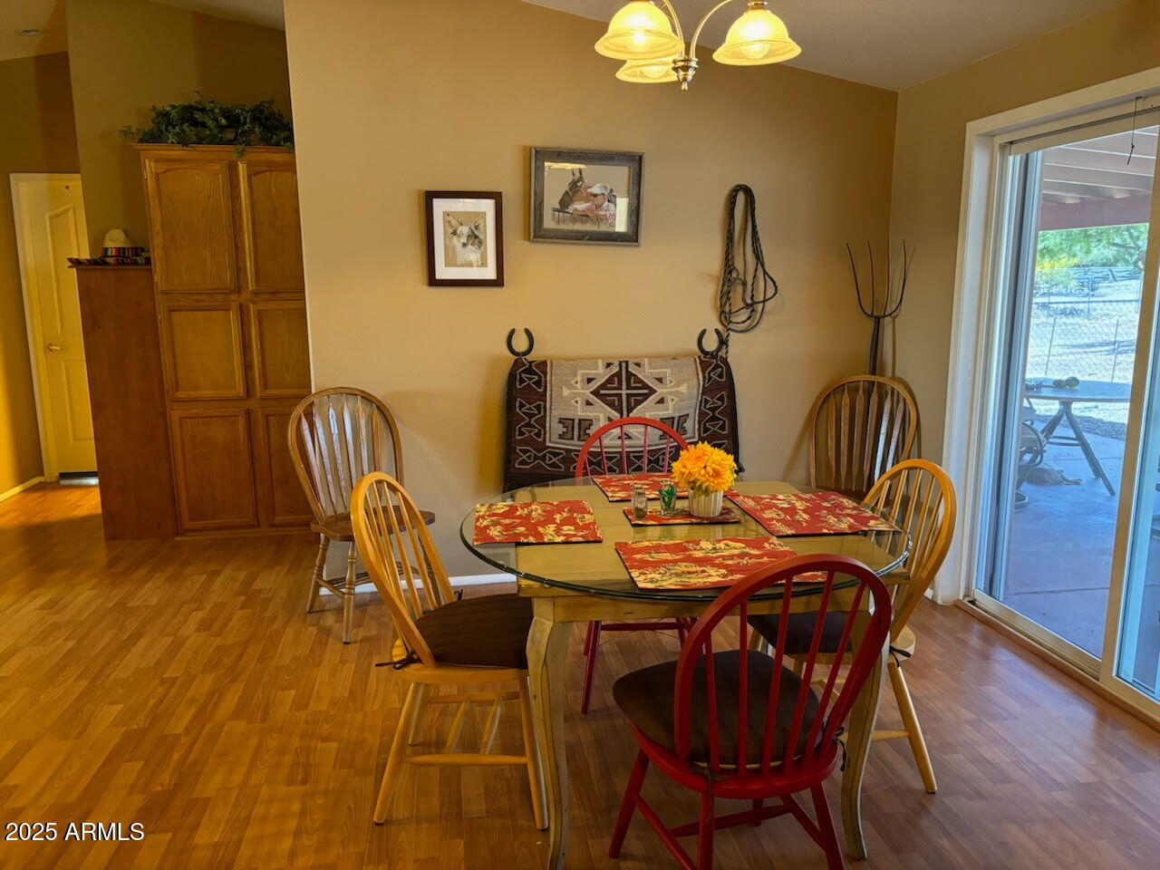 23300 West Mule Deer Lane, Unit 2 Congress, AZ 85332 - Photo 8 of 17 a view of a dining room with furniture and wooden floor