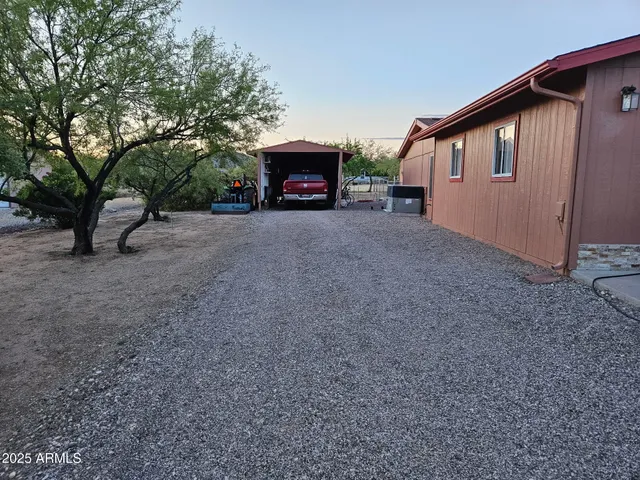 a view of a house with a yard and garage