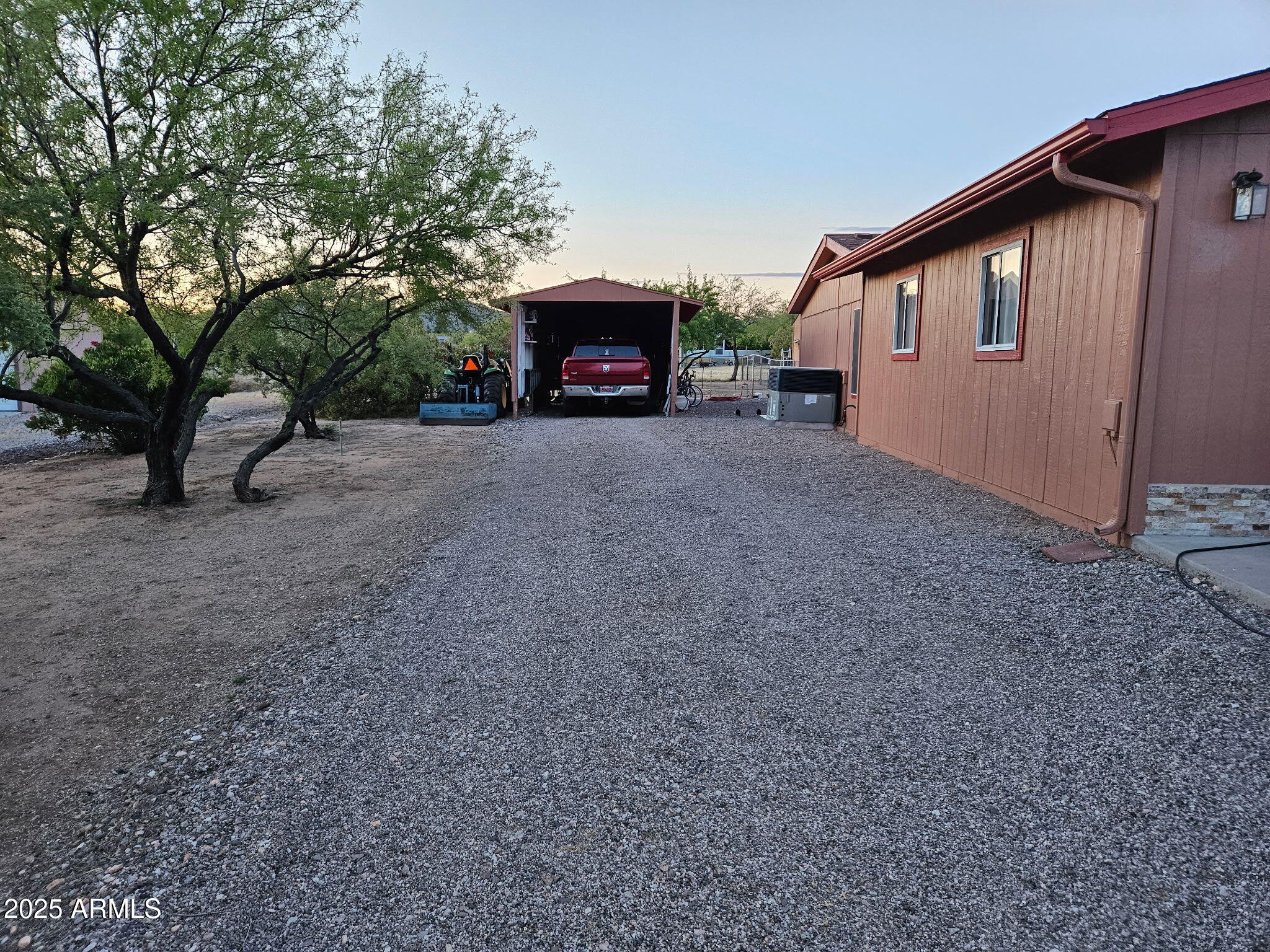23300 West Mule Deer Lane, Unit 2 Congress, AZ 85332 - Photo 9 of 17 a view of a house with a yard and garage