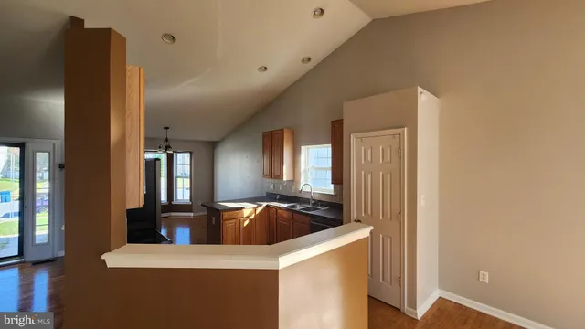 a view of front door with wooden floor