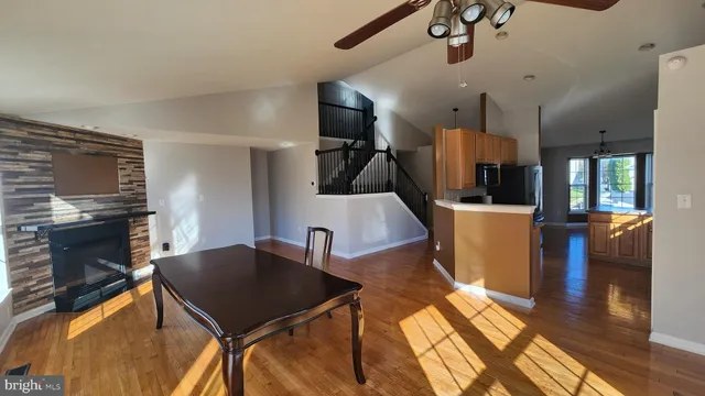 a living room with furniture flat screen tv and a fireplace