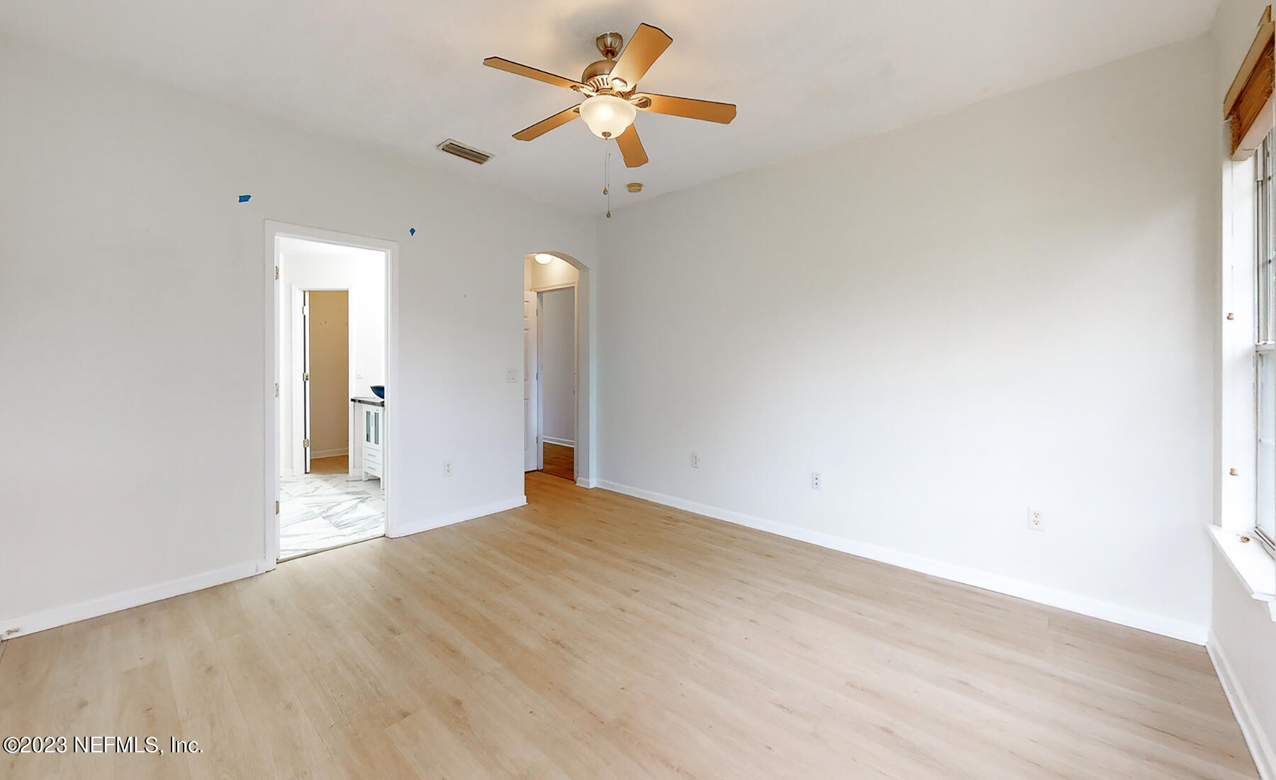 132 Summerhill Circle St. Augustine, FL 32086 - Photo 12 of 35 a view of a big room with a ceiling fan and a window