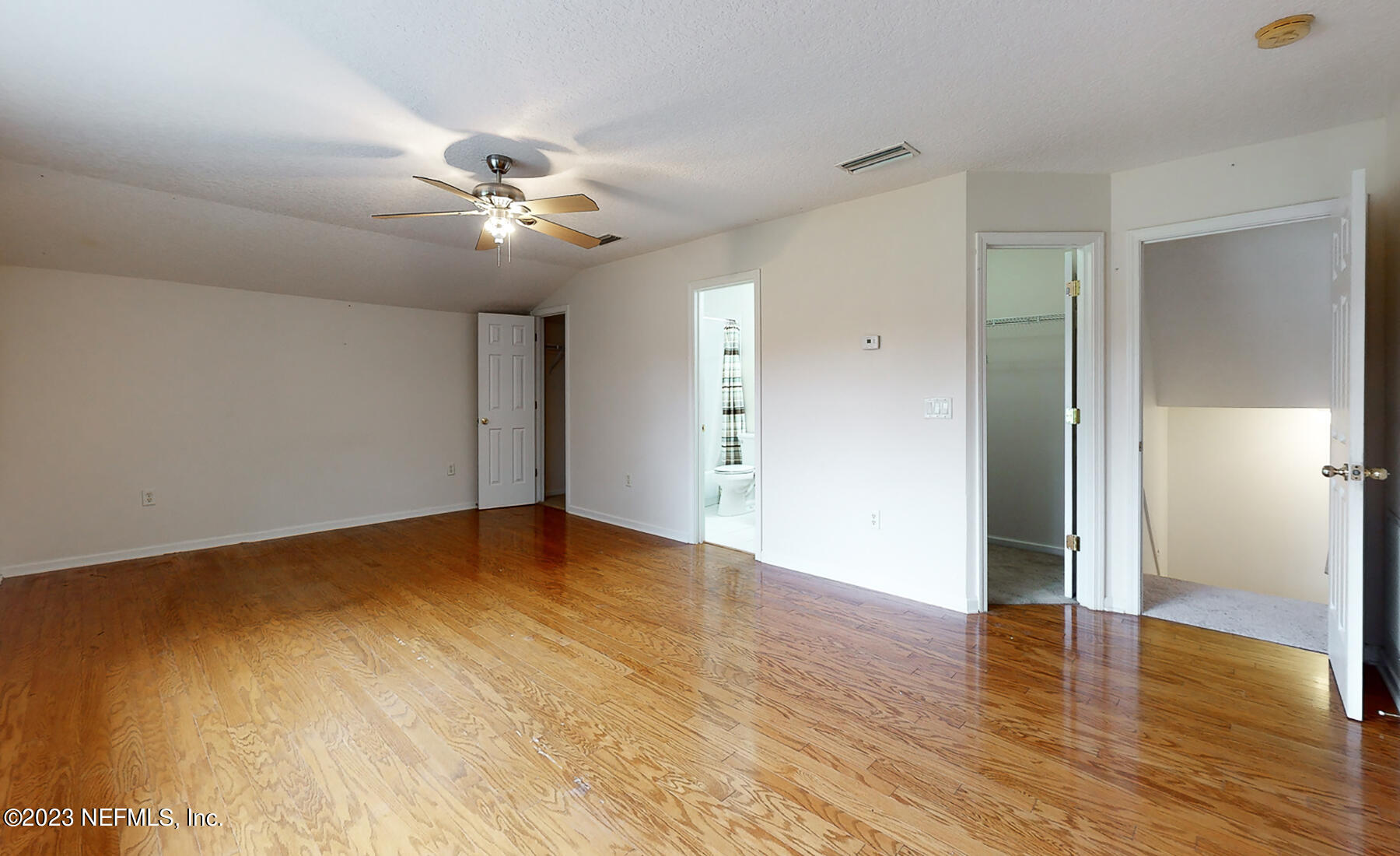 132 Summerhill Circle St. Augustine, FL 32086 - Photo 21 of 35 a view of an empty room with wooden floor