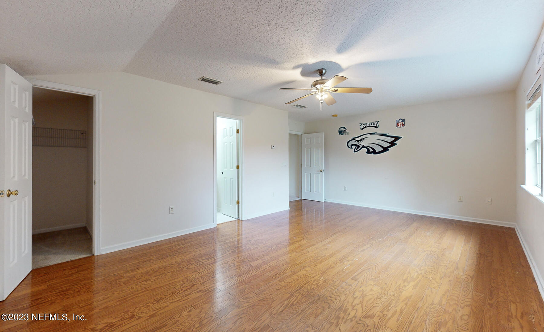 132 Summerhill Circle St. Augustine, FL 32086 - Photo 23 of 35 wooden floor in an empty room with a window