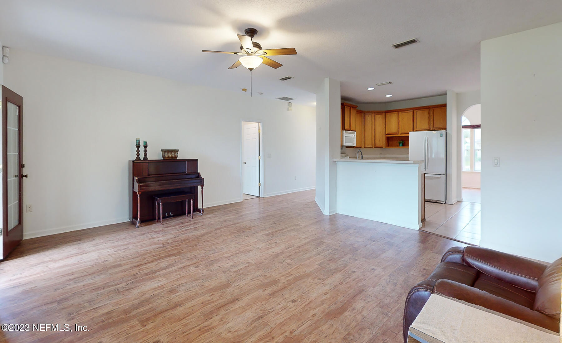 132 Summerhill Circle St. Augustine, FL 32086 - Photo 24 of 35 a view of a livingroom with a furniture wooden floor and a chandelier