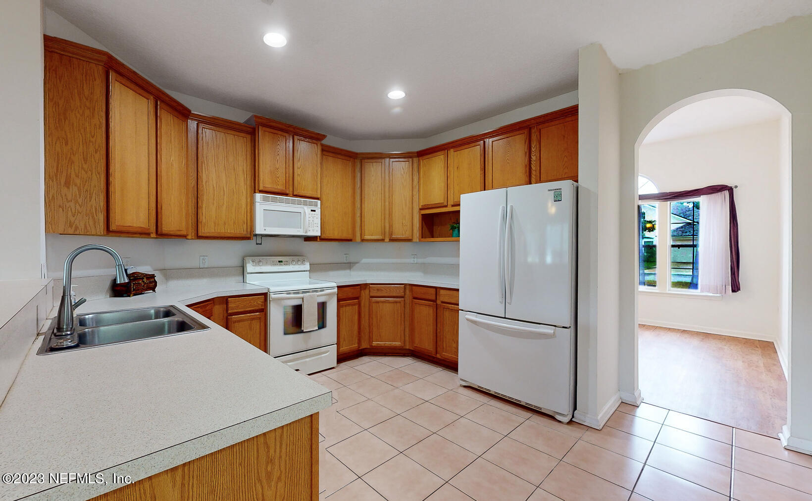 132 Summerhill Circle St. Augustine, FL 32086 - Photo 25 of 35 a kitchen with stainless steel appliances granite countertop a refrigerator sink and stove