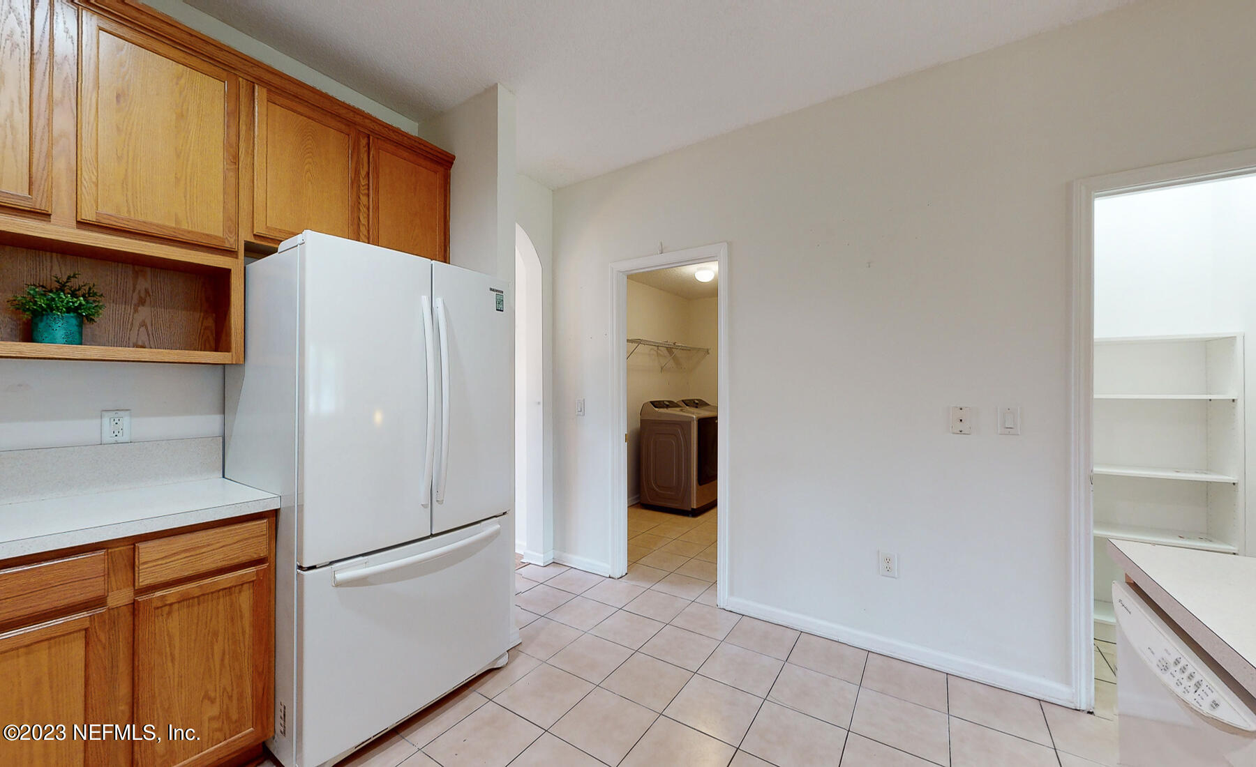 132 Summerhill Circle St. Augustine, FL 32086 - Photo 26 of 35 a white refrigerator freezer and a stove sitting inside of a kitchen