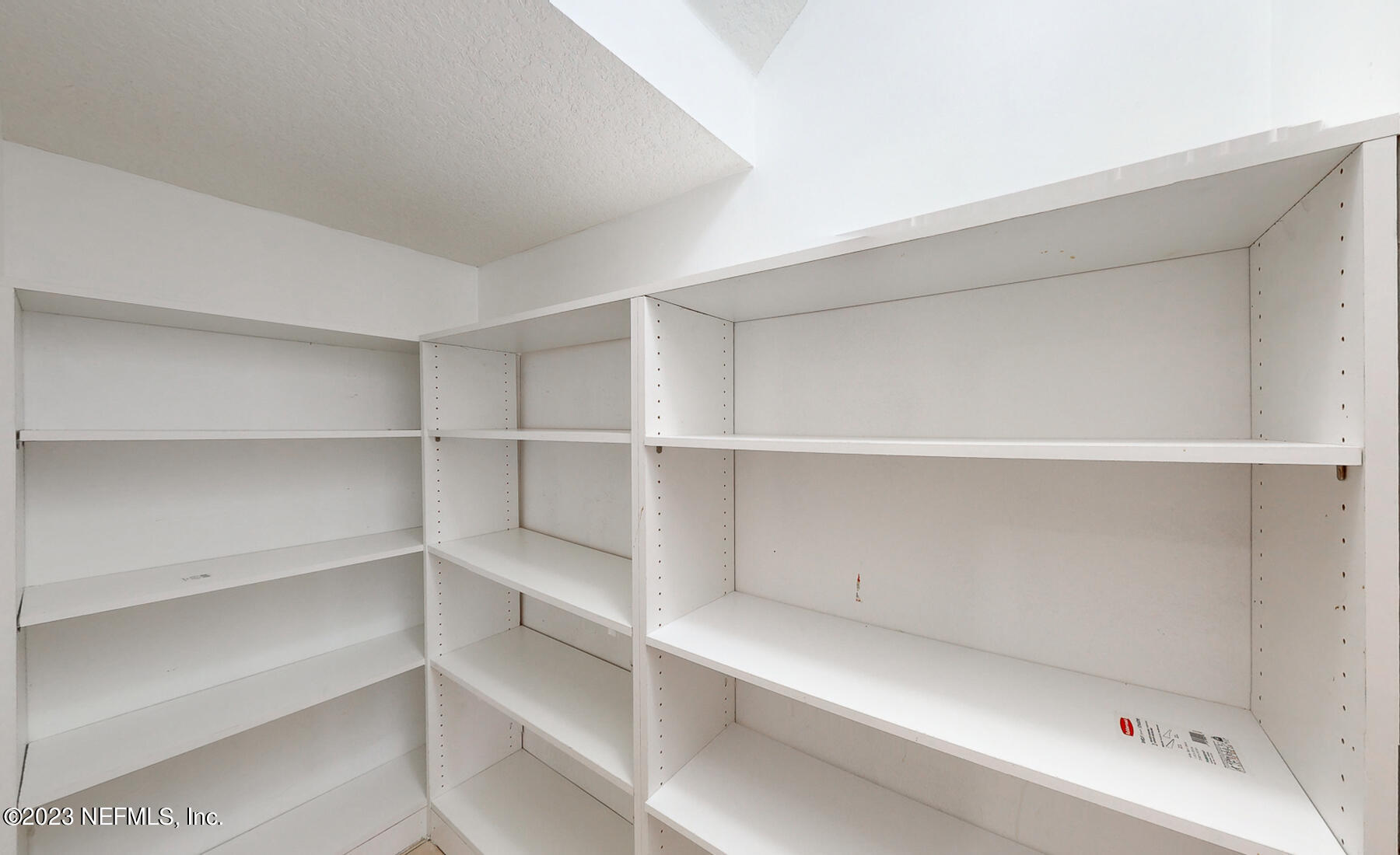 132 Summerhill Circle St. Augustine, FL 32086 - Photo 27 of 35 a view of walk in closet with empty racks