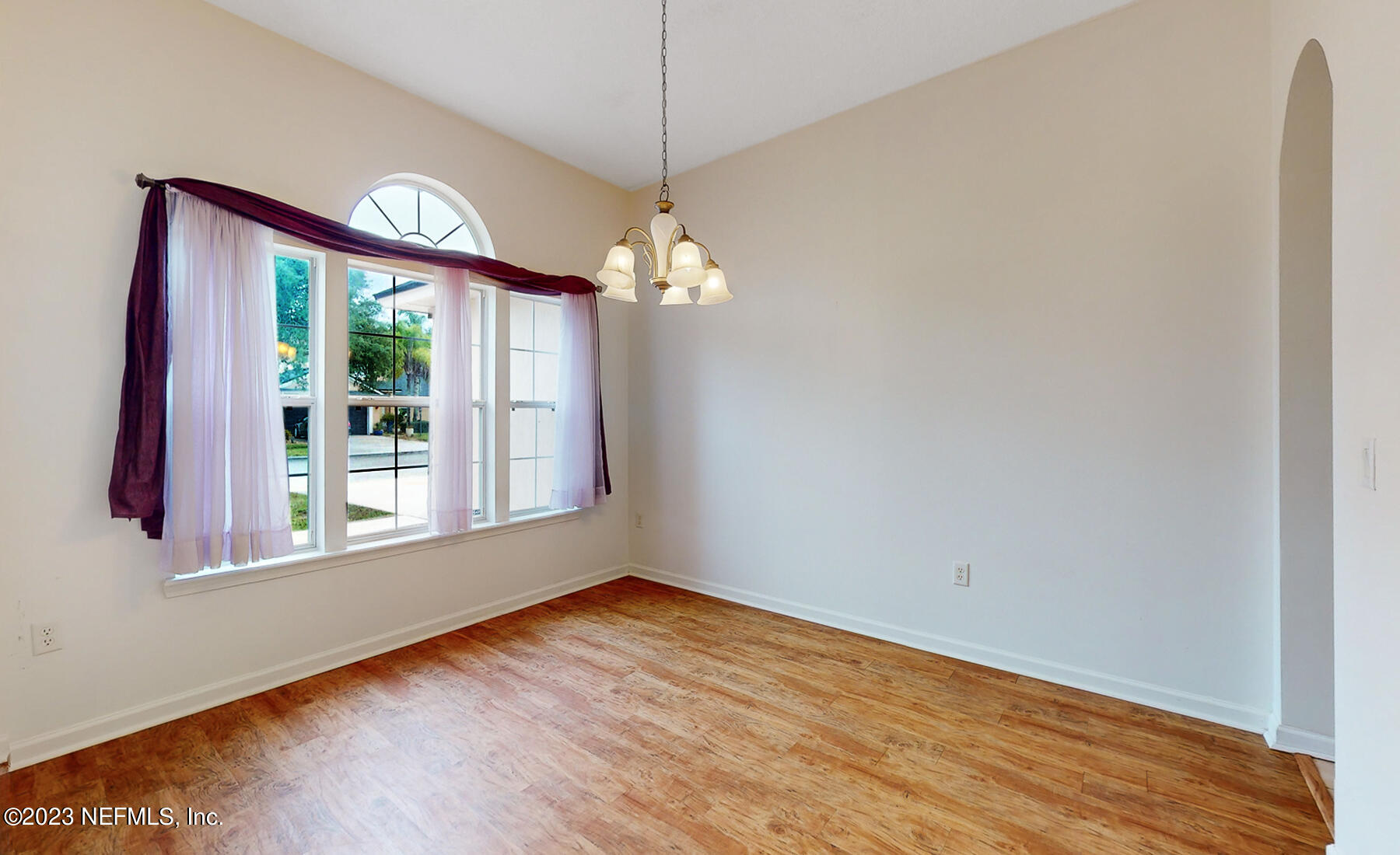 132 Summerhill Circle St. Augustine, FL 32086 - Photo 29 of 35 a view of an empty room with wooden floor and a window