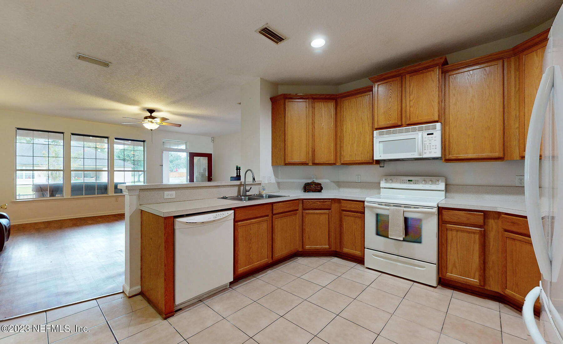 132 Summerhill Circle St. Augustine, FL 32086 - Photo 31 of 35 a kitchen with stainless steel appliances granite countertop a stove sink and cabinets