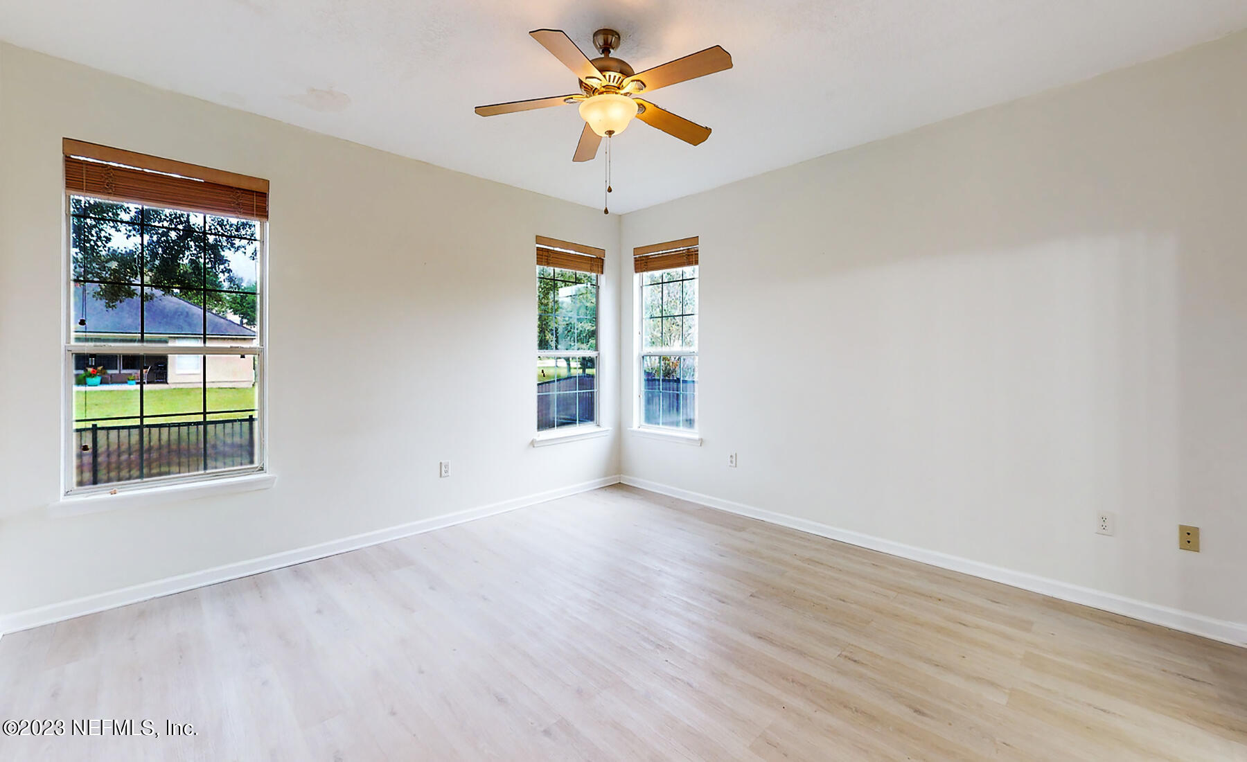 132 Summerhill Circle St. Augustine, FL 32086 - Photo 7 of 35 wooden floor in an empty room with a window