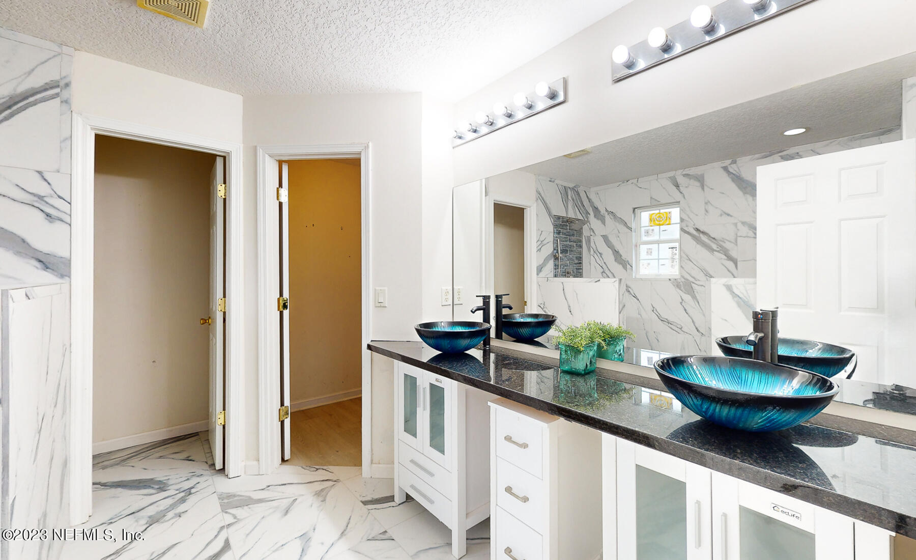 132 Summerhill Circle St. Augustine, FL 32086 - Photo 8 of 35 a kitchen with sink and refrigerator