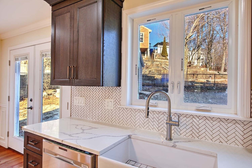 3 Wensley Street, Unit 1 Boston, MA 02120 - Photo 15 of 40 a living room with a table and painting on the wall