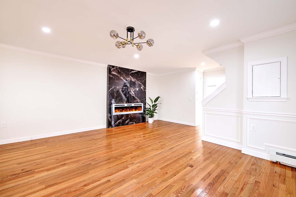 3 Wensley Street, Unit 1 Boston, MA 02120 - Photo 19 of 40 a view of empty room with wooden floor