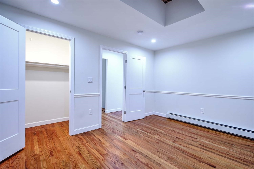 3 Wensley Street, Unit 1 Boston, MA 02120 - Photo 31 of 40 a view of empty room with wooden floor