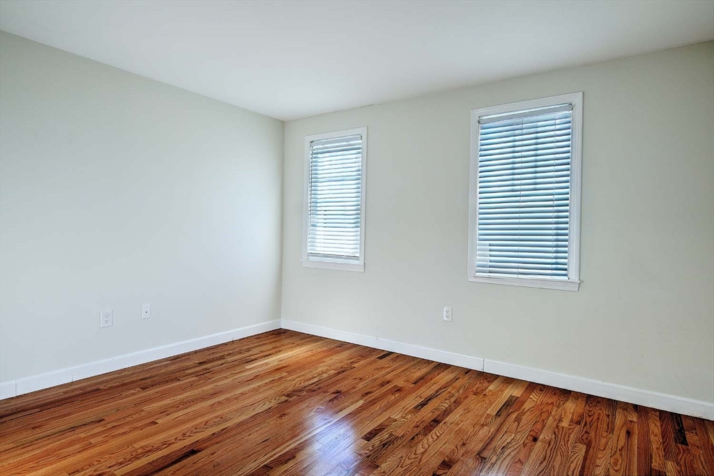 3 Wensley Street, Unit 1 Boston, MA 02120 - Photo 32 of 40 wooden floor in an empty room with a window