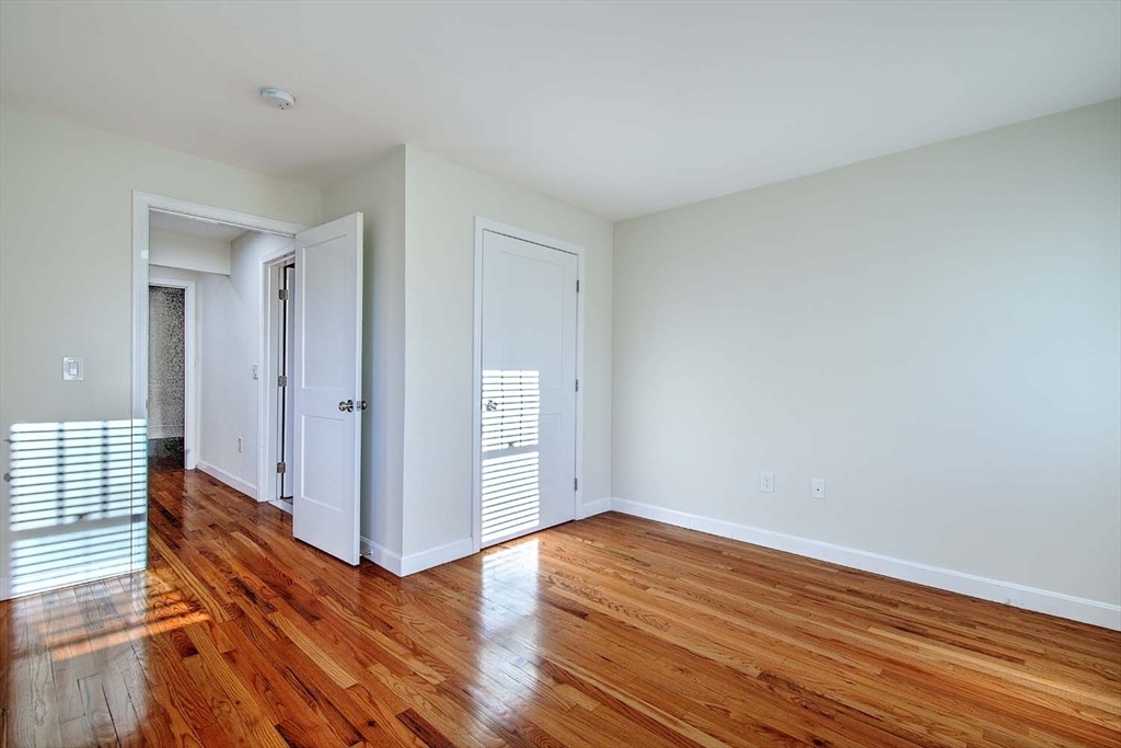 3 Wensley Street, Unit 1 Boston, MA 02120 - Photo 33 of 40 wooden floor in an empty room