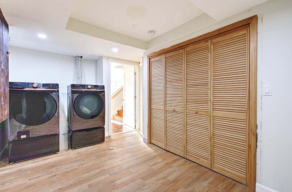3 Wensley Street, Unit 1 Boston, MA 02120 - Photo 37 of 40 a view of a kitchen with a washer and dryer