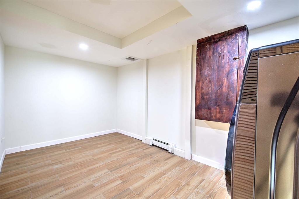 3 Wensley Street, Unit 1 Boston, MA 02120 - Photo 38 of 40 a view of hallway with wooden floor