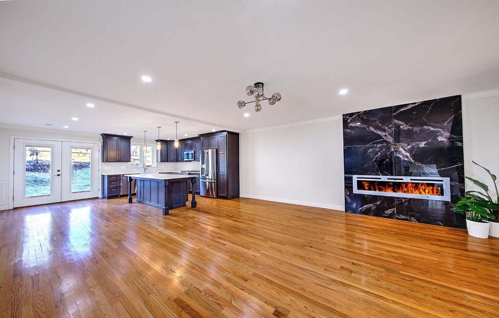 3 Wensley Street, Unit 1 Boston, MA 02120 - Photo 9 of 40 a view of an empty room with kitchen and window