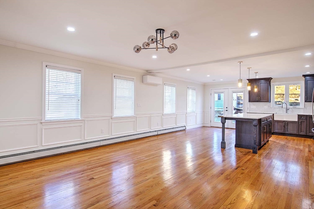 3 Wensley Street, Unit 1 Boston, MA 02120 - Photo 10 of 40 a large kitchen with cabinets wooden floor and stainless steel appliances