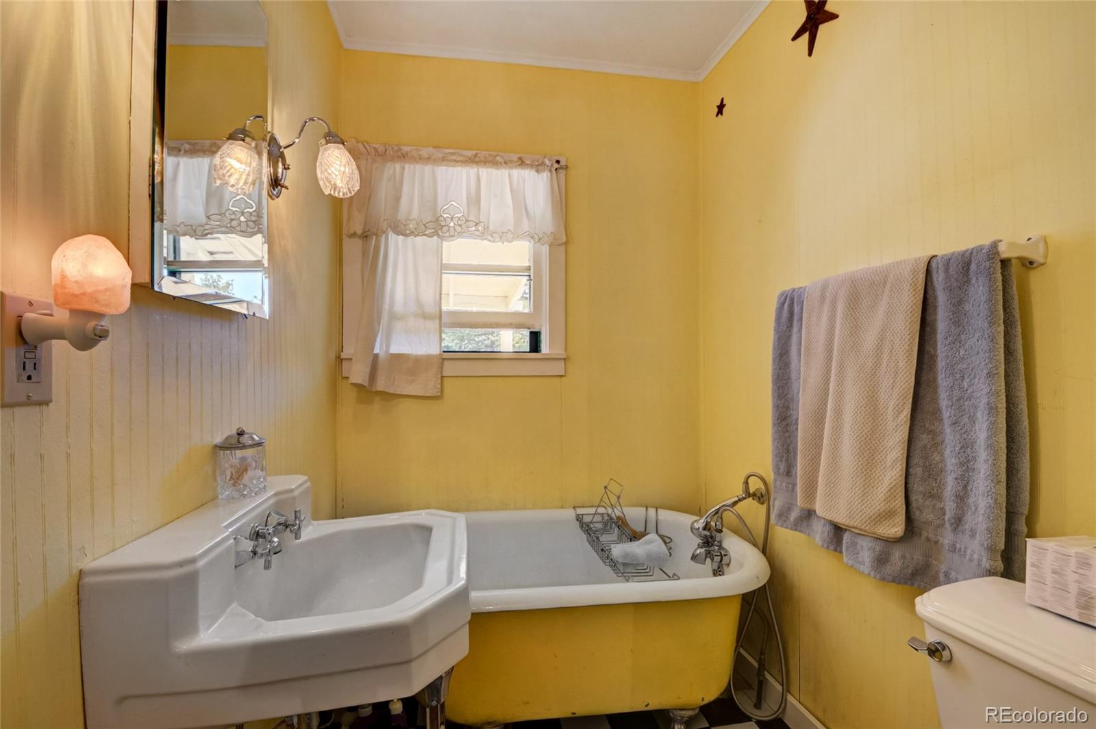 101 Main Street Bailey, CO 80421 - Photo 12 of 22 a bathroom with a tub sink and mirror