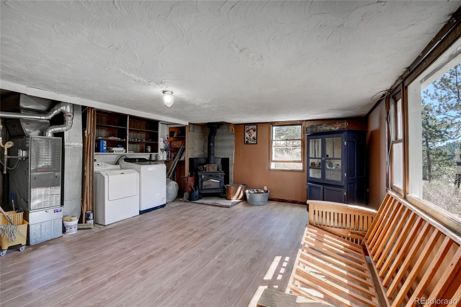 101 Main Street Bailey, CO 80421 - Photo 14 of 22 a view of a living room kitchen and a window
