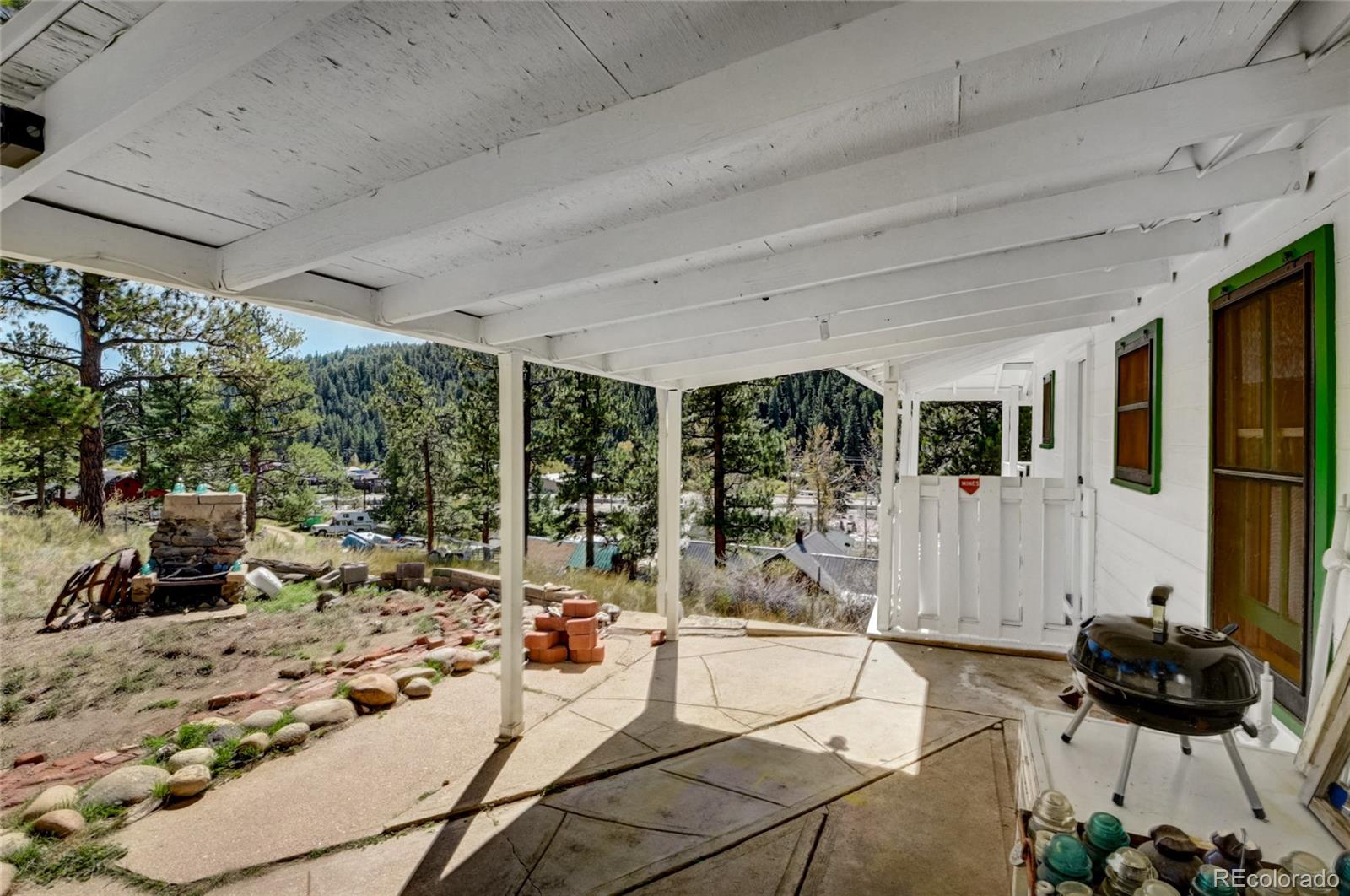 101 Main Street Bailey, CO 80421 - Photo 19 of 22 a living room with furniture and a floor to ceiling window