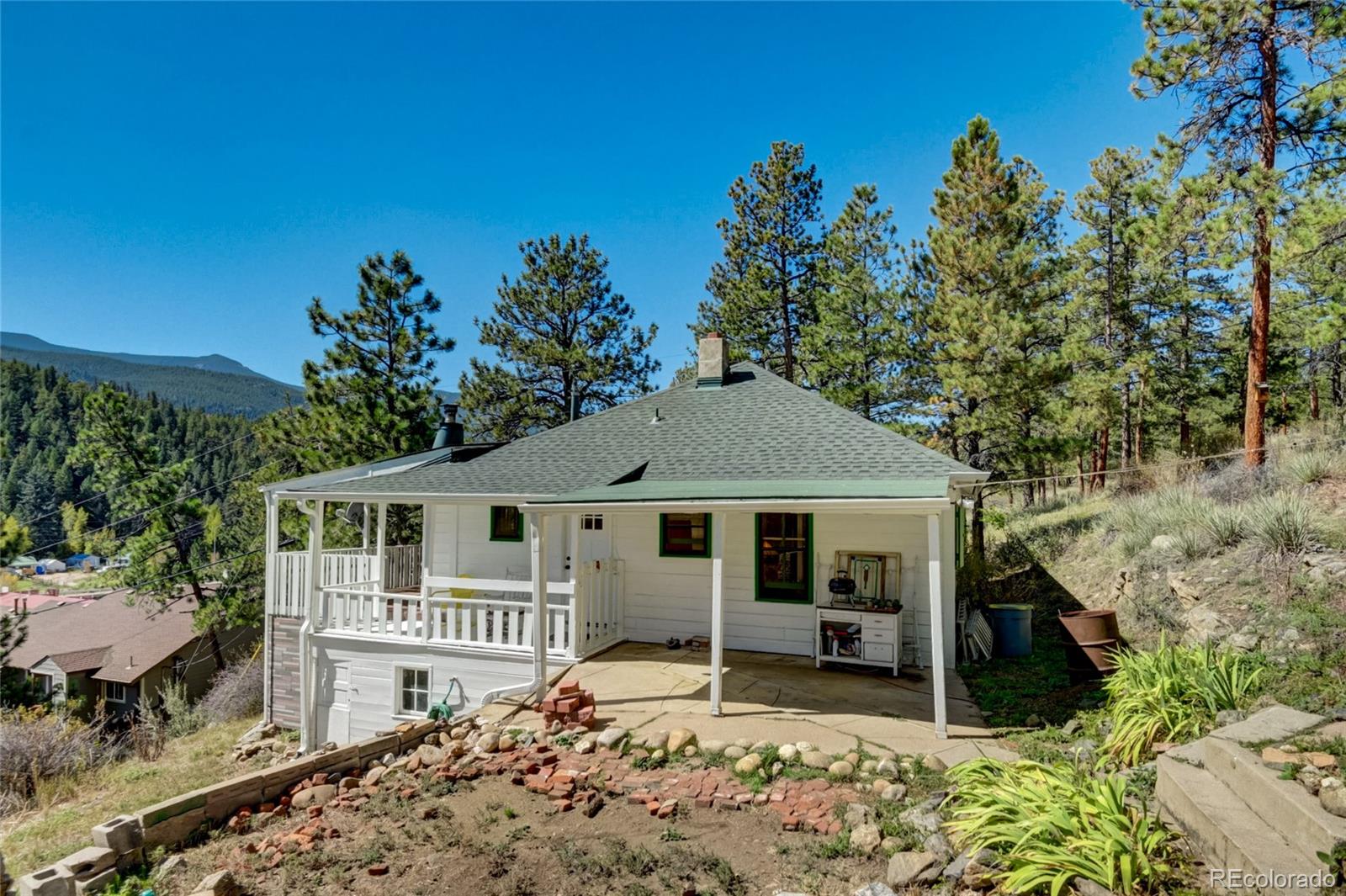101 Main Street Bailey, CO 80421 - Photo 2 of 22 a house with trees in the background