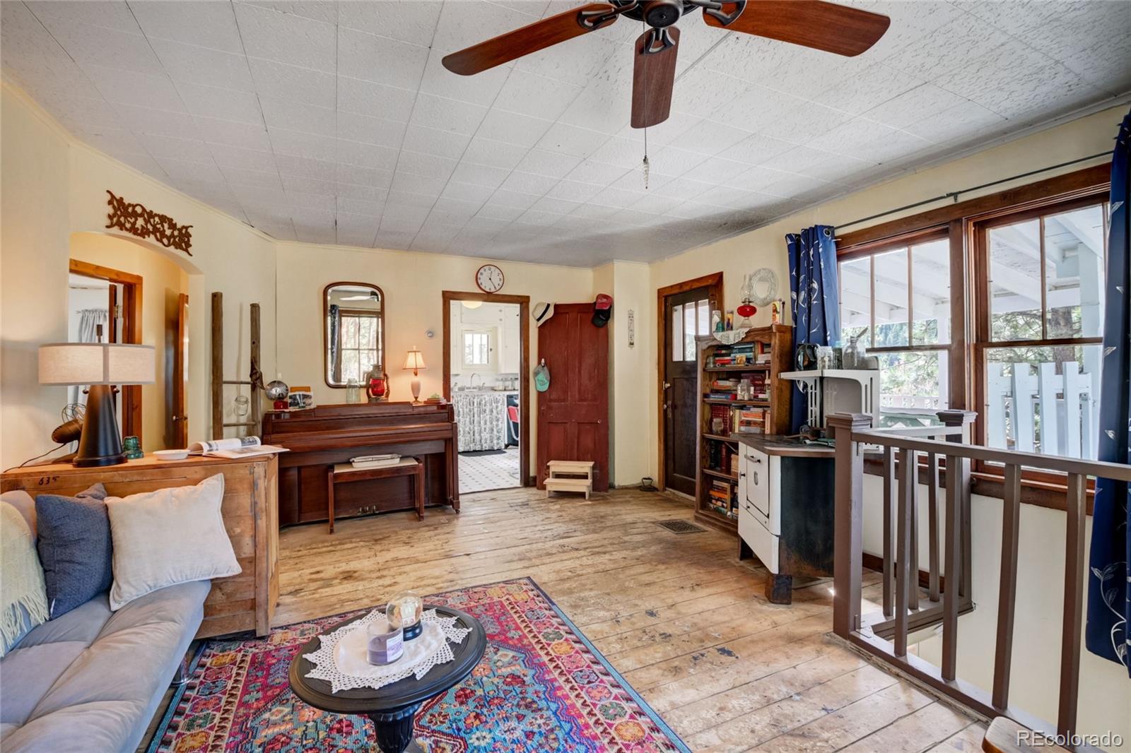 101 Main Street Bailey, CO 80421 - Photo 8 of 22 a living room with furniture and a floor to ceiling window