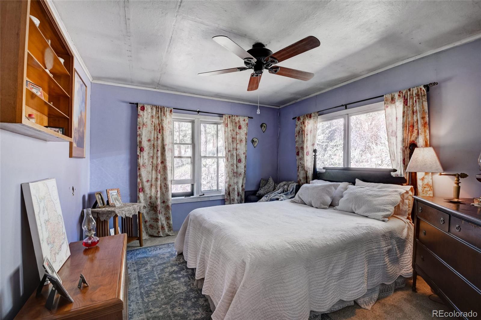101 Main Street Bailey, CO 80421 - Photo 9 of 22 a bedroom with a bed flat screen tv and a large window