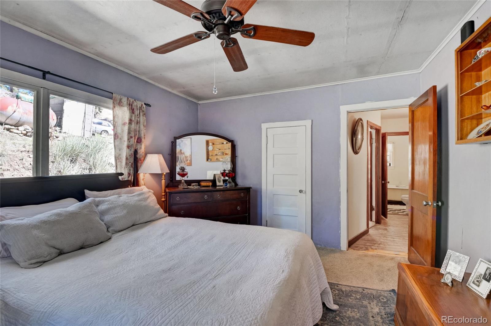101 Main Street Bailey, CO 80421 - Photo 10 of 22 a bedroom with a bed and a large mirror